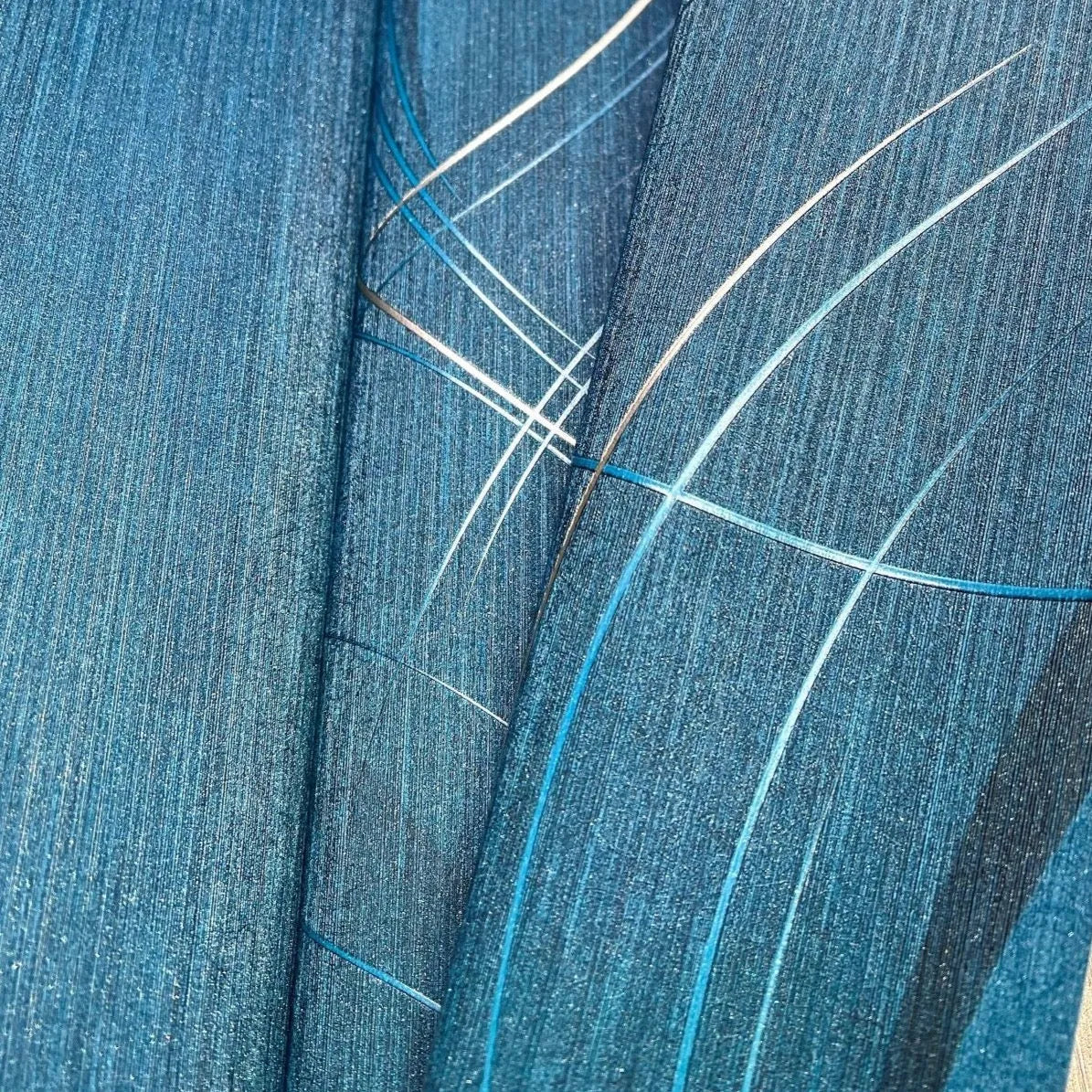 Wallpaper installed in a room showing its full pattern, color