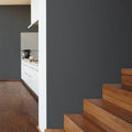 Wallpaper installed in a room showing its full pattern, color