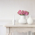 Wallpaper installed in a room showing its full pattern, color