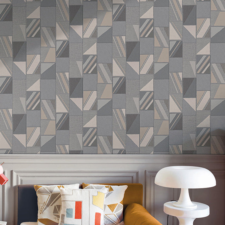 Textured fabric swatch with geometric pattern in brown, blue, and gray.