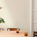 Wallpaper installed in a room showing its full pattern, color